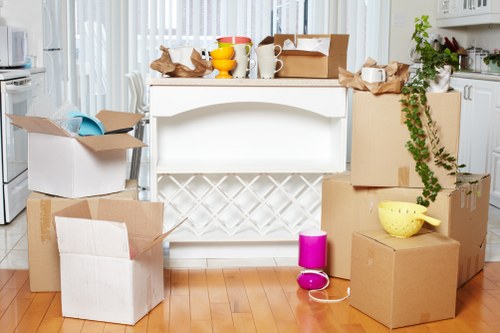 Loading boxes and household items into a van for a Croydon move