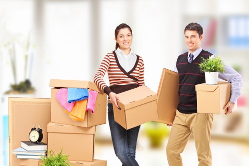 Man and van team preparing goods safely for loading