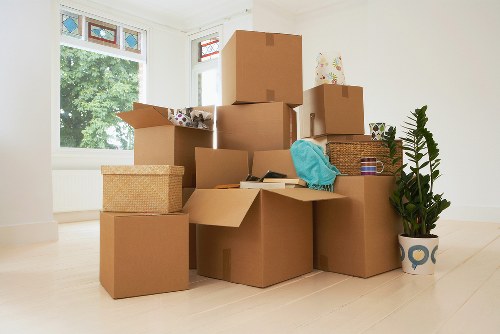 Team preparing office furniture and equipment for a move in Croydon