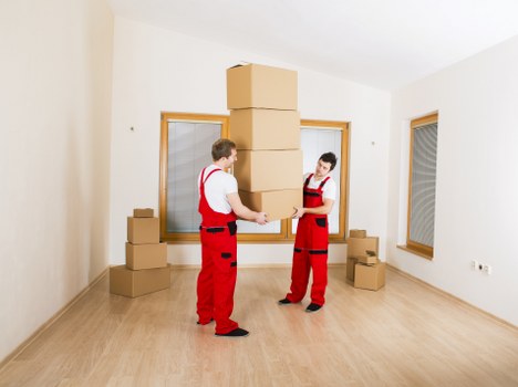 Packed boxes and furniture ready for collection in Croydon