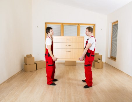 Furniture and boxes being loaded into a van for transport in Croydon